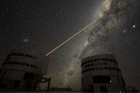This photograph was produced by European Southern Observatory, by Yuri Beletsky and licensed under the Creative COmmons Attribution 3.0.  http://en.wikipedia.org/wiki/File:A_Laser_Strike_at_the_Galactic_Center.jpg